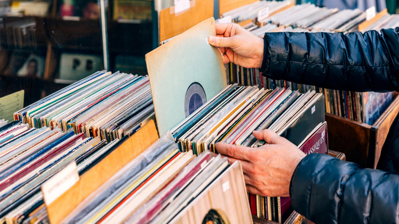 Someone perusing through vinyl records