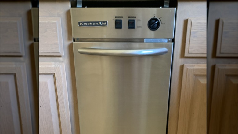 Trash compactor in a kitchen