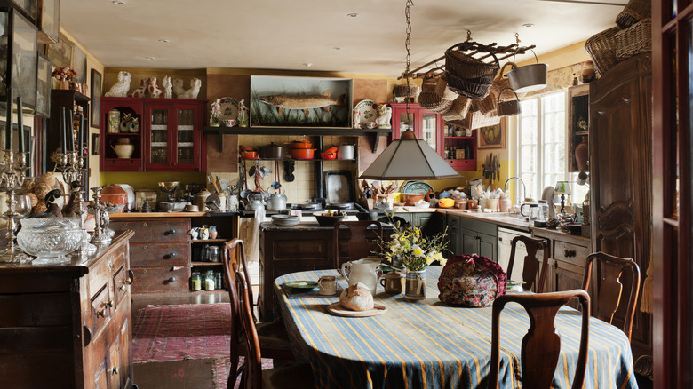 Country kitchen filled with clutter, decor, and other things