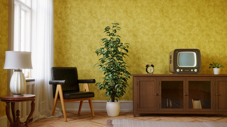 A 1960s living room interior with yellow wallpaper