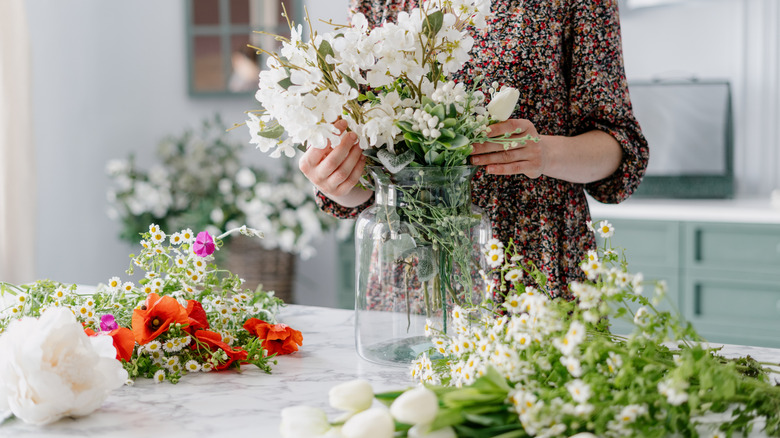Adding flowers to vase
