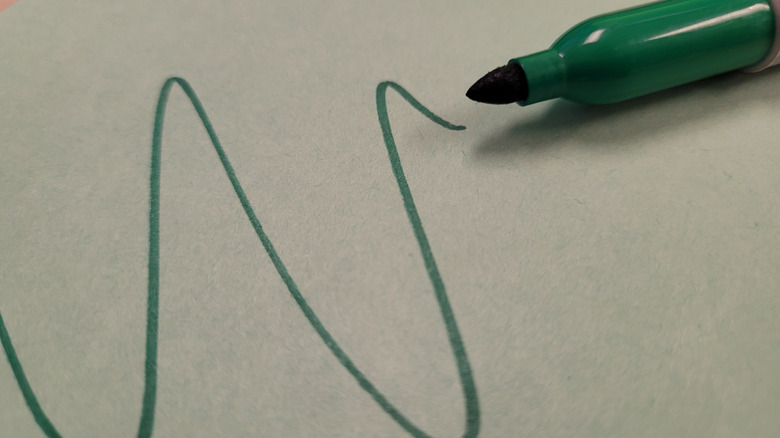 Green scribble with closeup of green Sharpie tip.