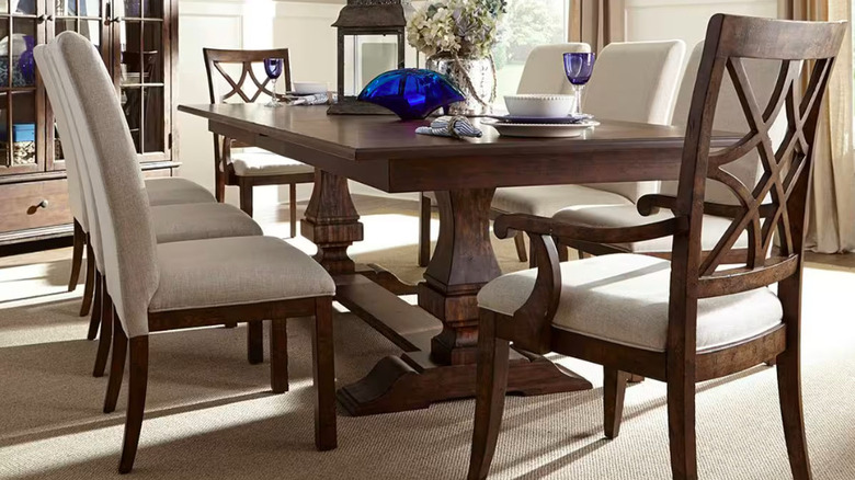 A dining room table with chairs.