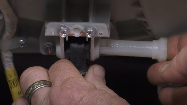 Securing shock absorber with pin