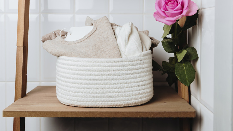 Cotton rope basket holding baby clothes