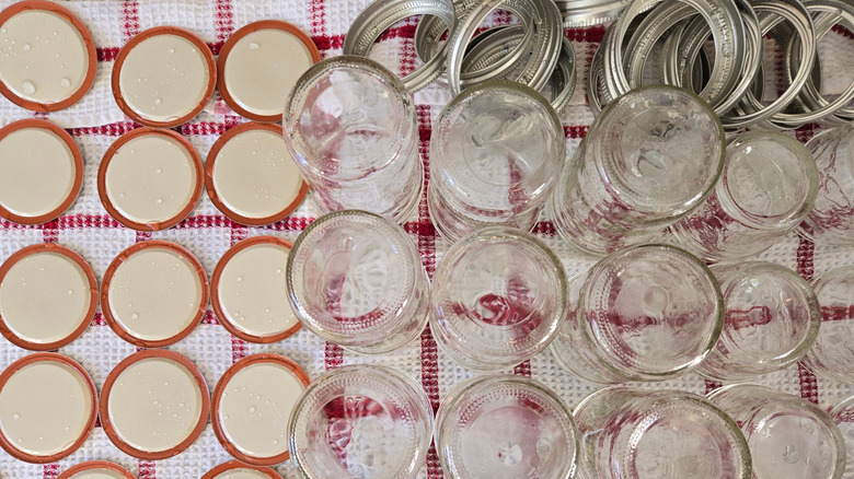 Mason jars and lids on tea towel after being washed