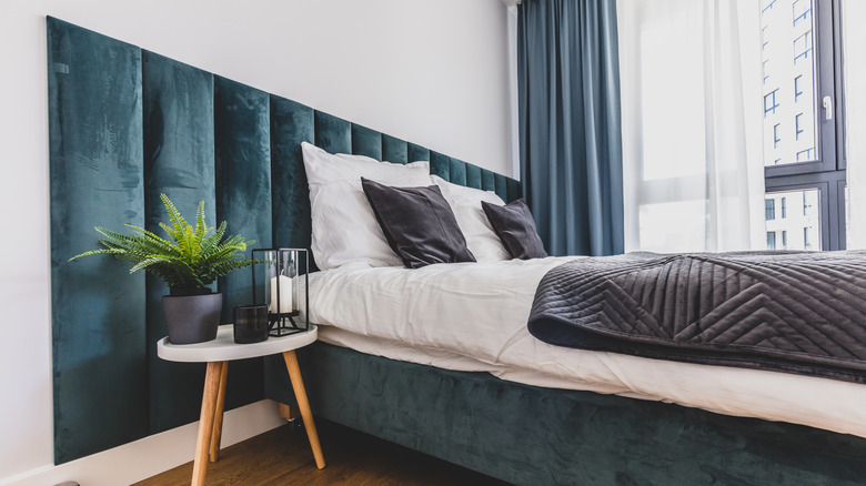 bedroom with upholstered headboard