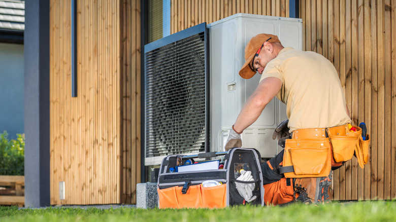 person working on AC unit