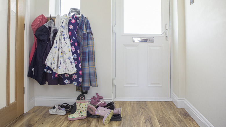 Messy pile of shoes in entryway