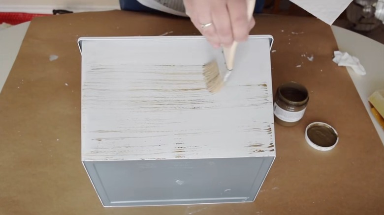 A painted bin from the Dollar Tree for storage