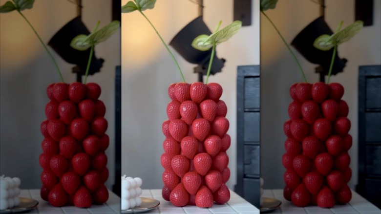 IKEA carafe spray painted red and decorated with plaster of paris strawberries