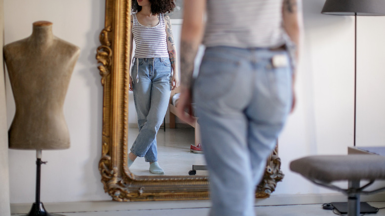 Girl's reflection in vintage mirror