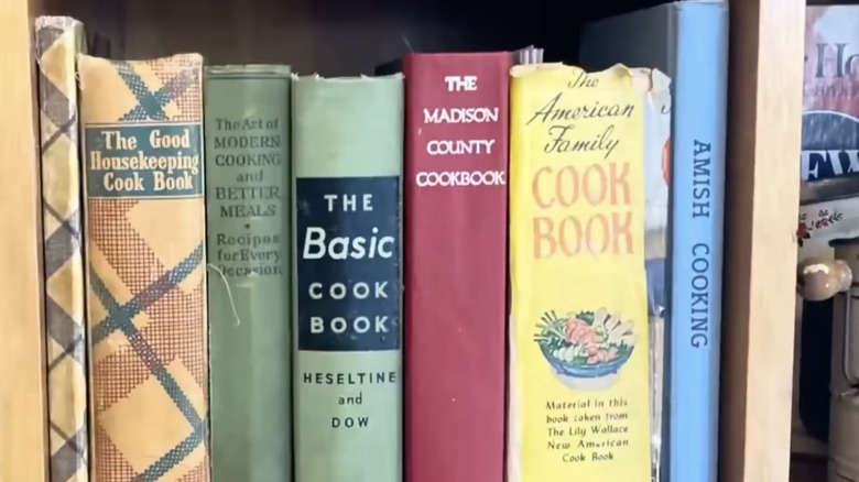 Homemade magazine holder in the style of a cookbook alongside other cookbooks