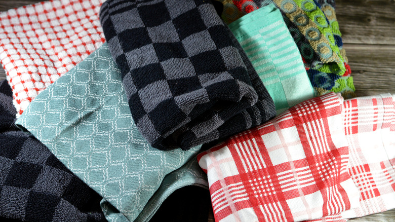 Kitchen towels thrown in a pile.