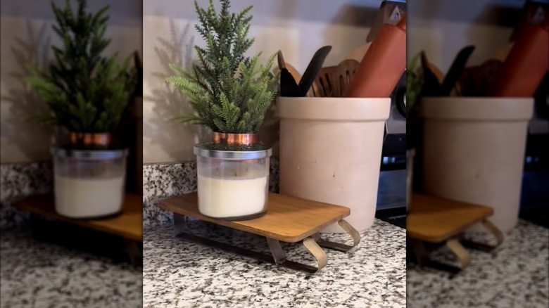 A DIY mini sleigh made from a cutting board.