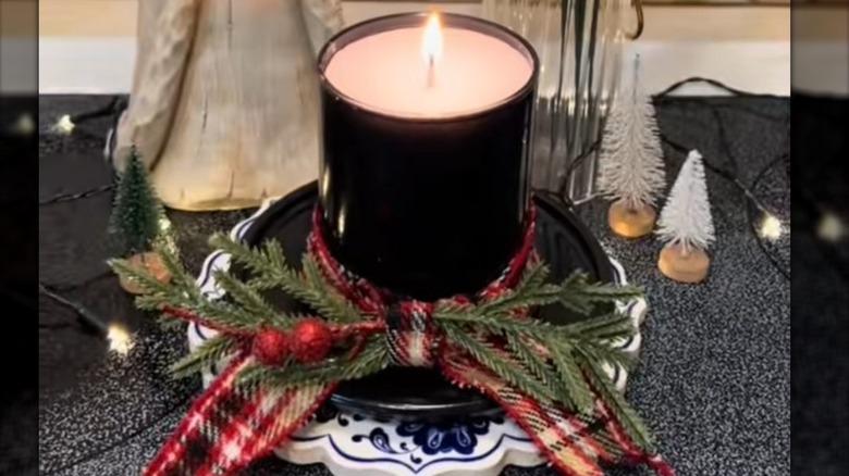 View of a snowman hat candle made from a glass candleholder and a glass plate