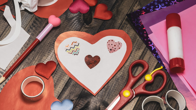 Valentine's Day crafting supplies sitting on a table