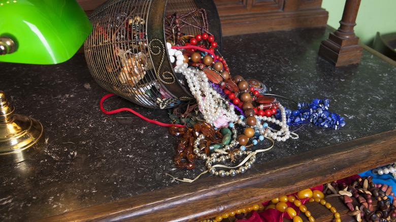 jumbled jewelry on dresser and in drawer