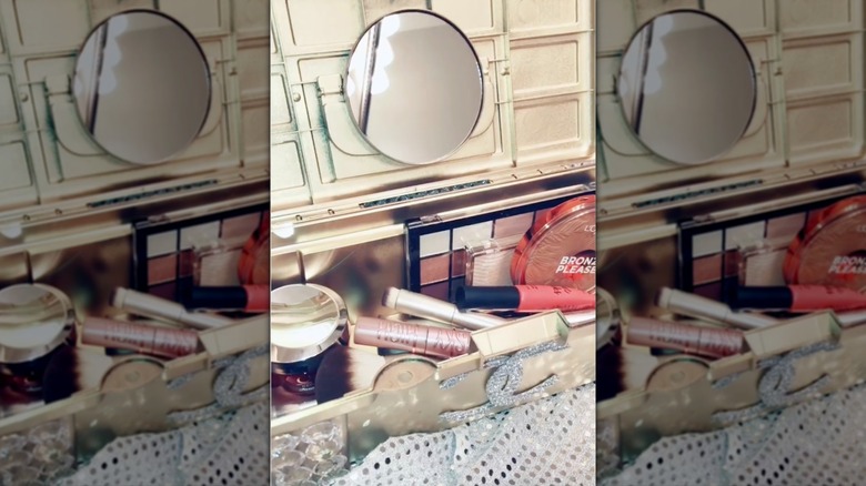 Dollar Tree tool box turned into a gold makeup case.