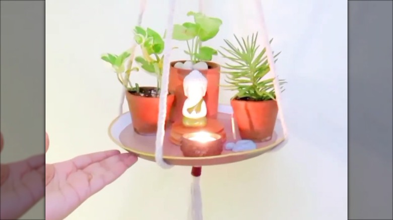 A plant hanger made from a frying pan