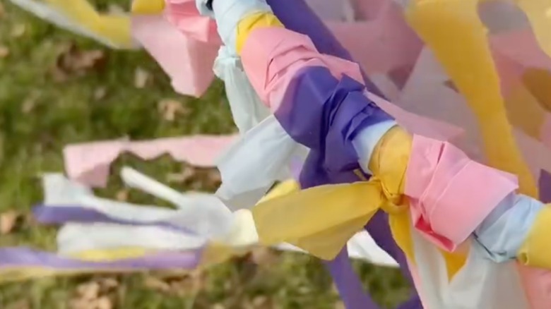 Close up of the knots used to attach the plastic strips to the hula hoop