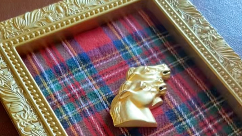 Gold framed holiday decor made from a plaid shirt