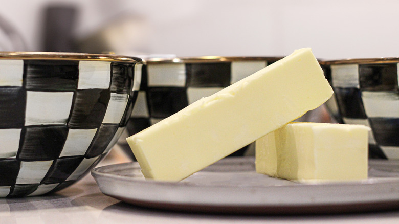 Mackenzie-Childs dishes with some sticks of butter