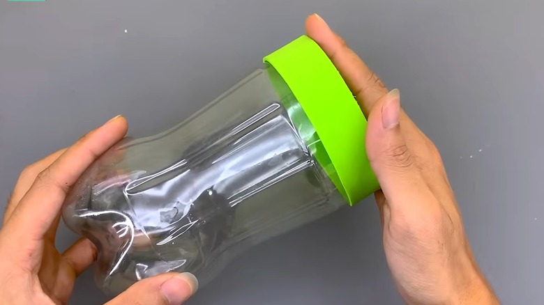 DIYer fitting 1-inch lid rim around the storage container