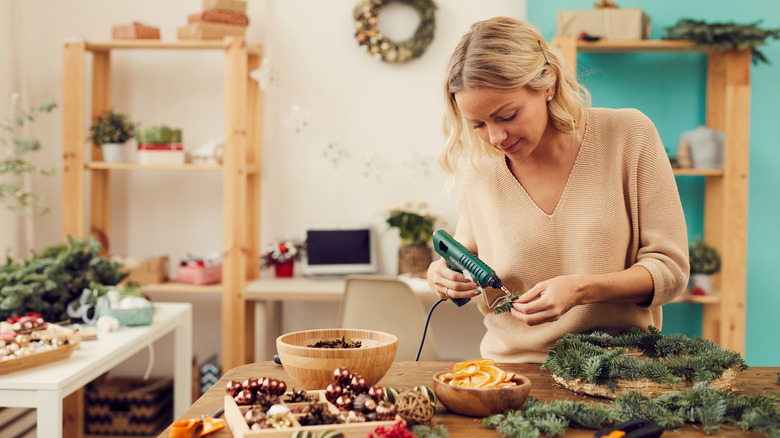 Woman making Christmas wreaths