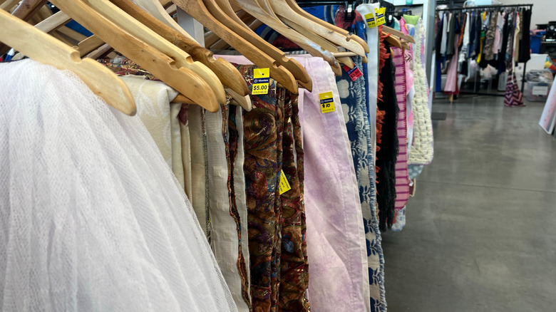 Curtains and linens hanging at thrift store