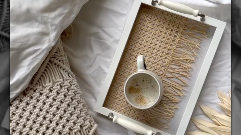 Tray table with rattan webbing and mug