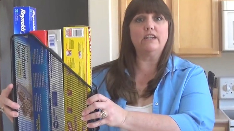 Holding magazine rack storing foil and saran wrap