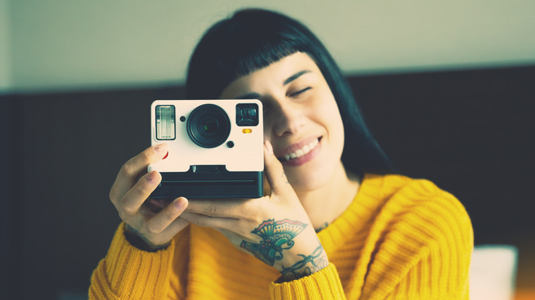 Person holding a vintage camera