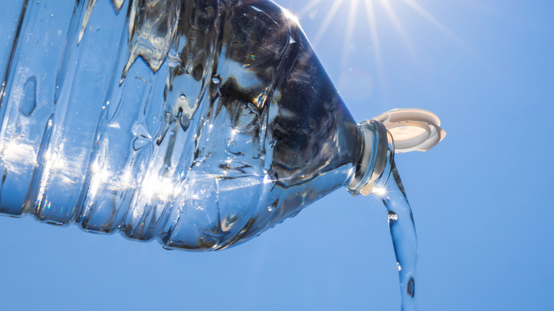 Water being poured out of plastic jug