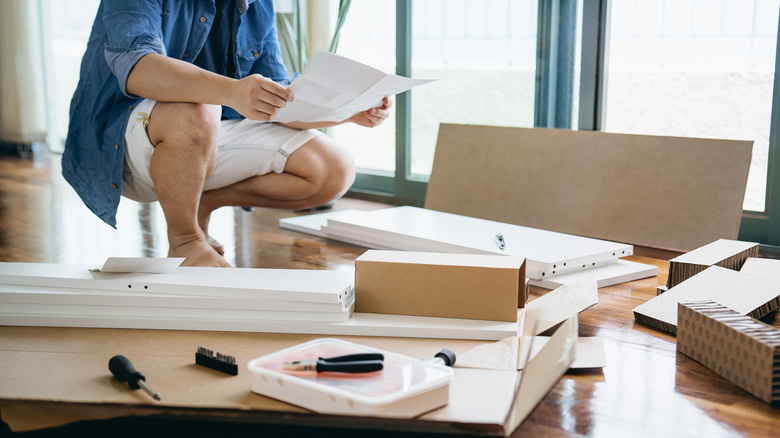 Person preparing to build IKEA furniture