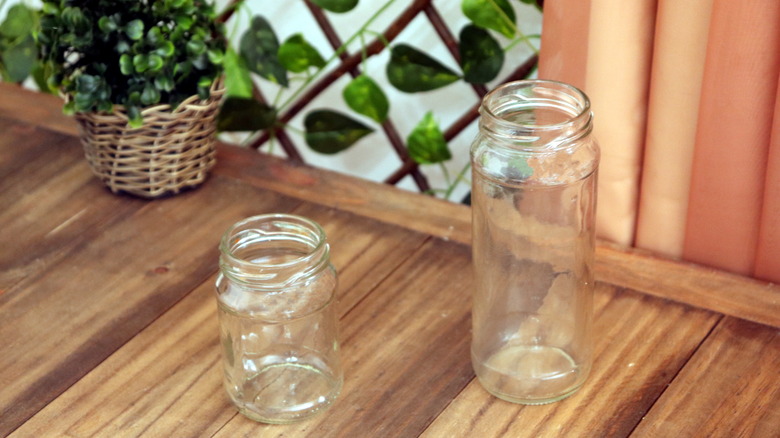 Pair of glass jars next to a faux plant