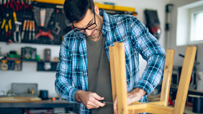 Someone working on a stool DIY