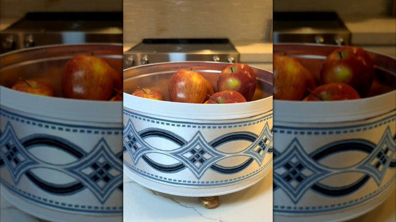 Apples in a repurposed cookie tin