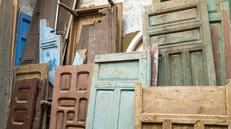pile of old wooden doors