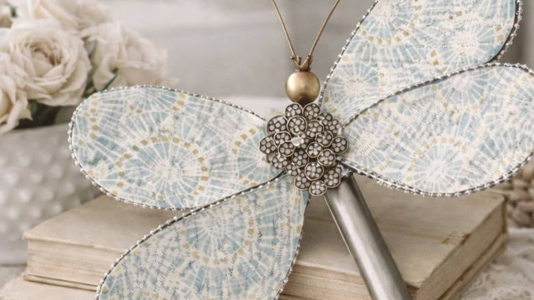 A whisk made into a sparkling dragonfly craft.