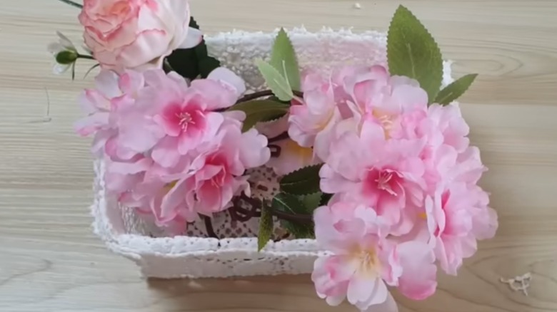 basket from lace filled with flowers