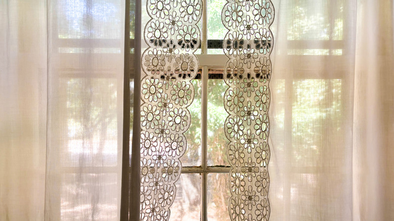 light streaming through lace curtains