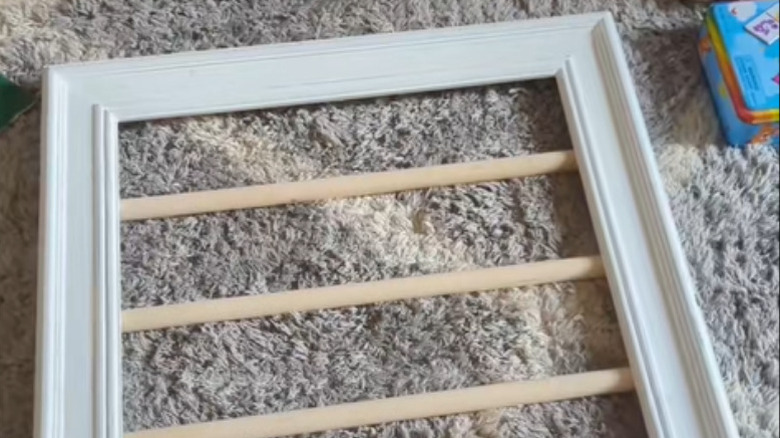 DIY clip storage solution made from an old picture frame