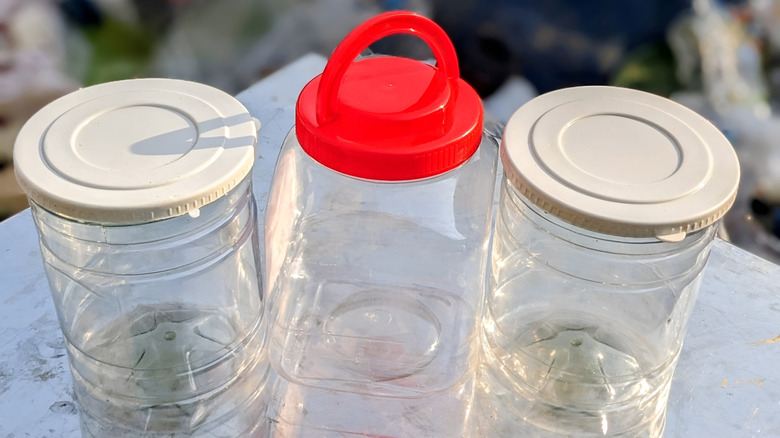 three empty plastic containers