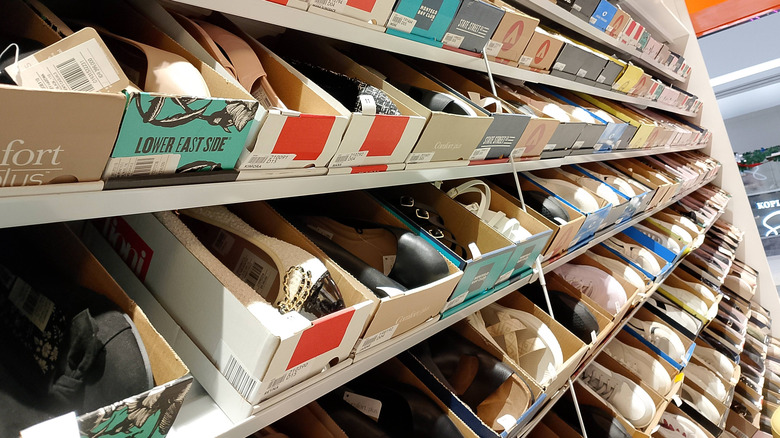 Shoes in boxes on a store shelf
