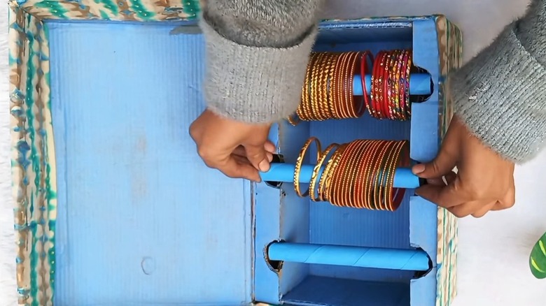 An overhead shot of a jewelry box customized for storing bangles