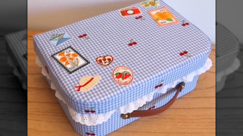 Storage box decorated with gingham fabric and iron-on patches