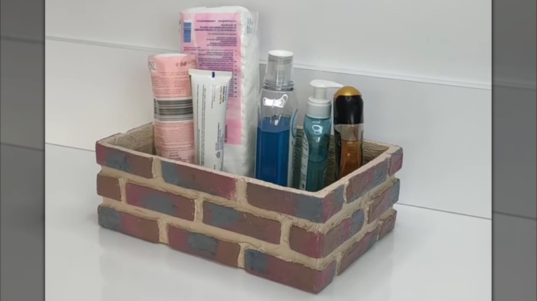 Brick DIY container holding toiletries