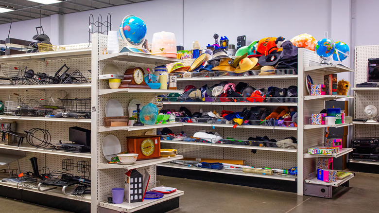 Various magazine and other racks on the shelves of a thrift store.
