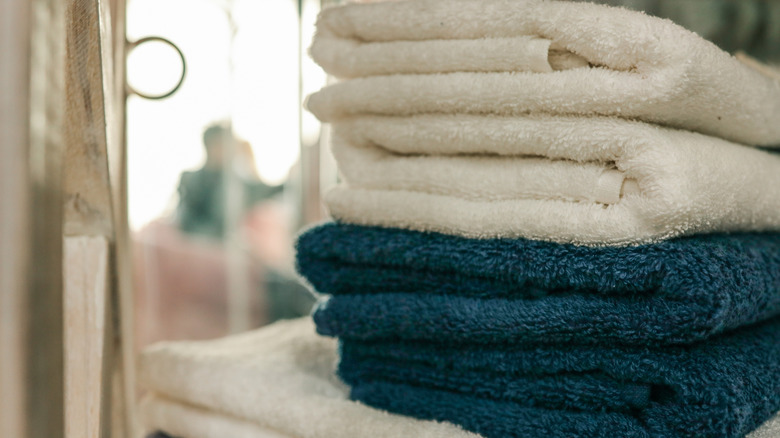 A folded stack of towels against a blurred background